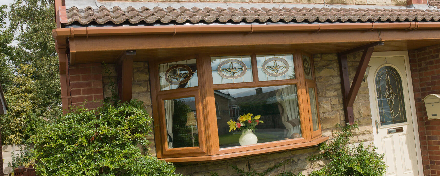 Golden Oak UPVC Bay Window Exterior - Warm Wood Finish