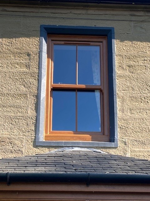 UPVC Vertical Slider Golden Oak Window - Premium Wood Grain